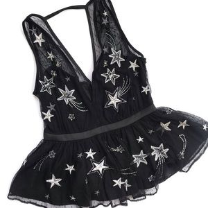 Black peplum top with mesh and star detail